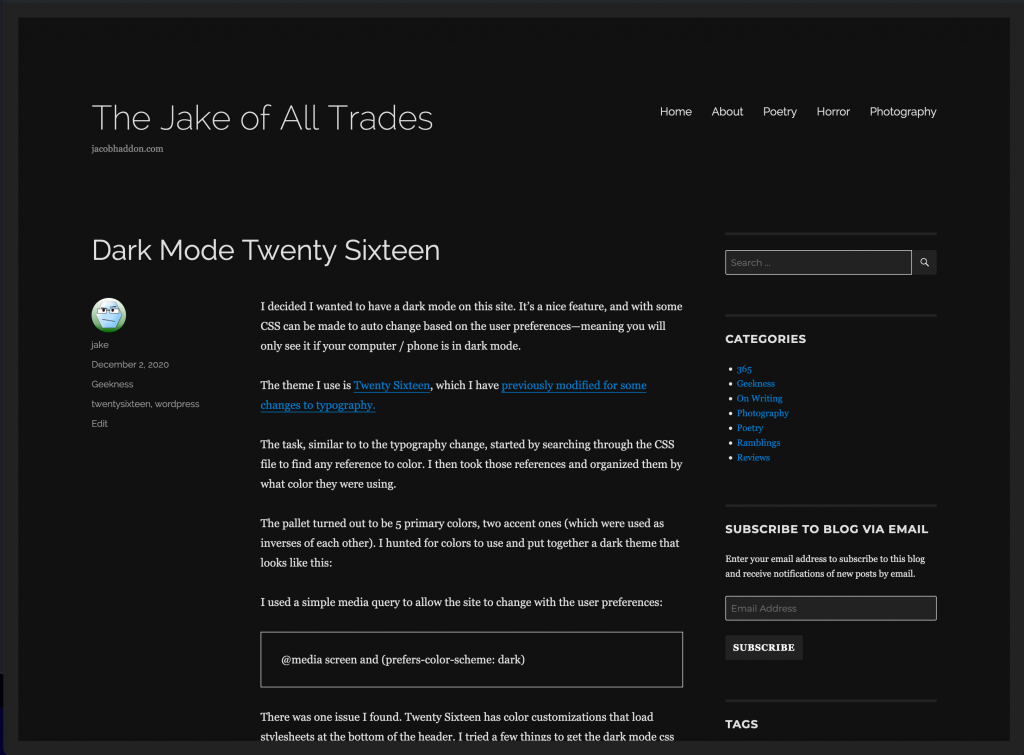 screenshot of this website with the dark mode theme active, background is black and dark grey, words are white and blue